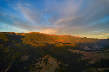 Sunset over the mountains in the Carpathians. Aerial drone view.