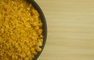 Yuca couac table top view. Grainy flour from bitter cassava, unprocessed, raw and organic.