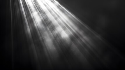 A beam of light shining down from the top left corner, with rays spreading out to form an abstract background on a black and white gradient background.