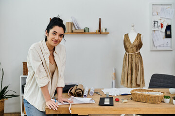 A young woman stands by a wooden table, upcycling her clothes in an eco-friendly manner.