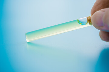 a small bottle of perfume with pheromones that induces sexual attraction