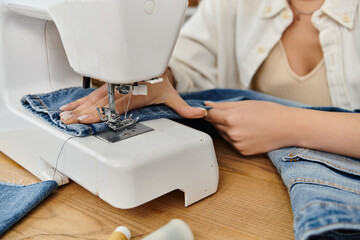 A young woman in casual attire creating upcycled jeans on a sewing machine.