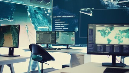 Empty military drone control center equipped with a big screen to receive alerts, satellite radar...