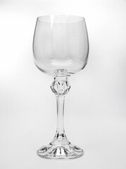 Beautiful large wine lamp on a white background. Transparent wine glass on a white background