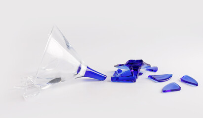 Broken wine glass on a white background.