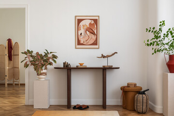 Cozy and stylish interior of living room with mock up poster frame, wooden console, flowers in...