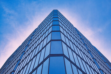 Fototapeta premium Ottawa, Ontario, Canada. May 20, 2024: Modern Bank of Canada office tower reaching towards the sky in downtown Ottawa.