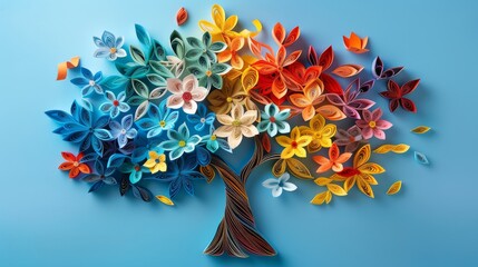 Colorful paper quilling tree art with vibrant flowers on a blue background, perfect for creative and decorative purposes.