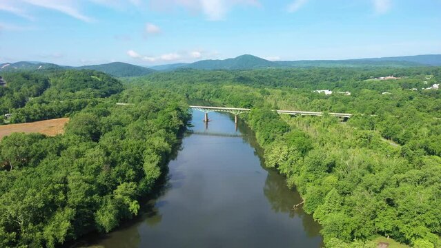 Aerial View of the Potomac River and Forest in Maryland With A Bridge Near Hancock