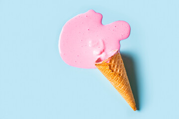 wafer cone with melted pink ice cream