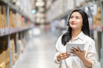 Female engineer is handling shipping and checking stock inventory in the warehouse with a tablet, industry, import-export, inventory management, logistics, global transportation at warehouse, business