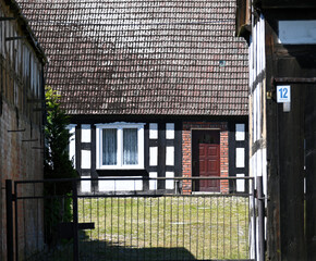The traditional half timbered house in old polish village. Example of half timber architecture.