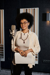 A talented woman stands poised in front of a microphone, ready to lend her voice to a music band...