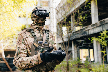 UAV Army operator in FPV glasses controls drone with bomb to drop to enemy. Concept modern war with...
