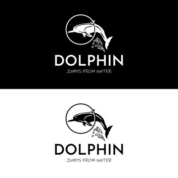 Dolphin jumps from water through a circle in simple silhouette logo design