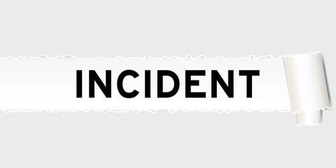 Ripped gray paper background that have word incident under torn part