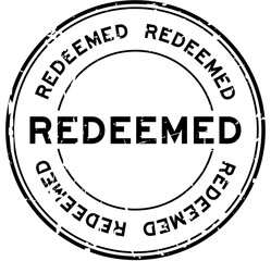 Grunge black redeemed word round rubber seal stamp on white background