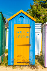 Blue and orange wooden beach hut of La Boirie beach on Oleron island, France