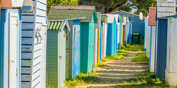 Row of small beach huts of La Boirie beach in Saint-Denis-d'Oleron, France