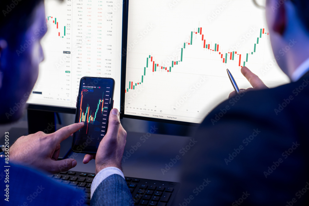 Poster two stock exchange traders researching data on smartphone and laptop screen server of dynamic digita