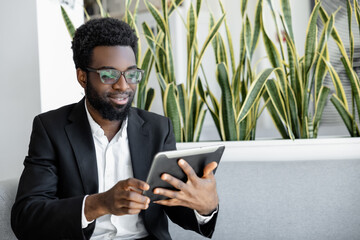 African american businessman in a black suit looking confident and determined