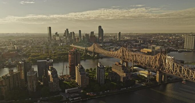 NYC New York Aerial v391 flyover capturing Queensboro bridge over East river, serene sunrise cityscape of Roosevelt Island and Long Island City in Queens - Shot with Mavic 3 Pro Cine - September 2023