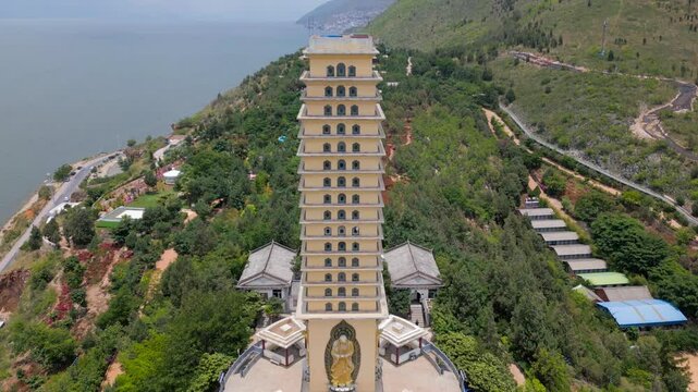 Close-up Drone footage of the Luo Quan Tower Panning to Er Hai in Dali, Yunnan, China
