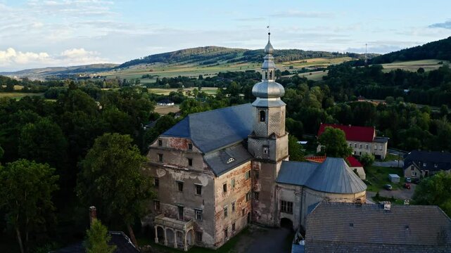 Reconstructed Palace Of Sarny In Klodzko County, Lower Silesia, Poland. drone pullback shot