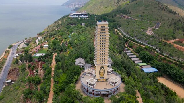 Majestic panning drone footage of the Luo Quan Tower in Dali, Yunnan, China