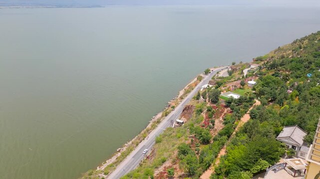 Traffic of road along Er Hai at Luo Quan Peninsula Tourism Zone in Dali, Yunnan, China