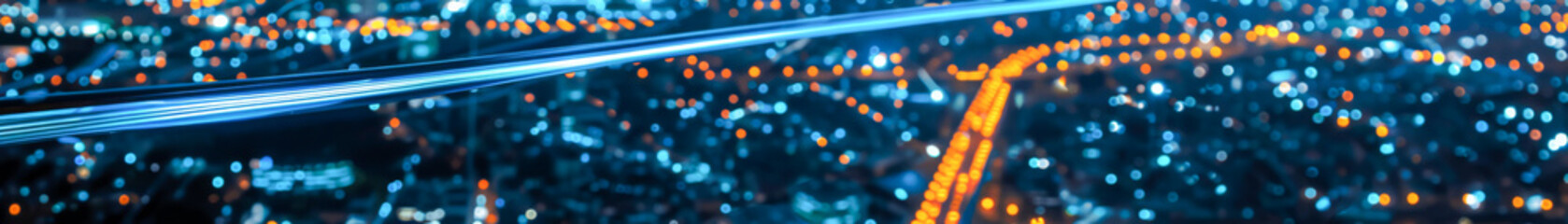 Illuminated Fiber Optic Cables Against Defocused City Lights
