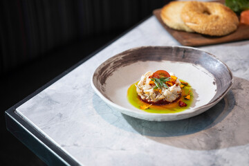 Crab cake dish in shallow bowl on table