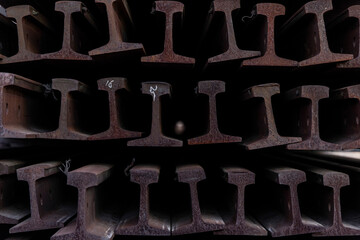 Rows of train track rails stacked in layers