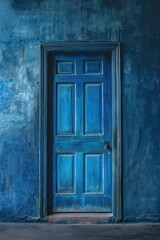 enigmatic blue door set in a moody blue wall