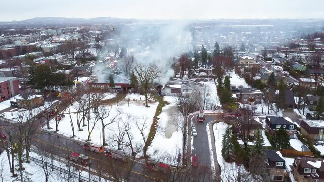 Fire at local school in Montreal Canada, fire brigade station extinguishing