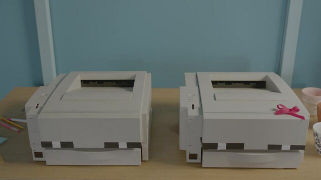 Two Old Printers in a Colourful Modern Office Setting, Camera Dollies in