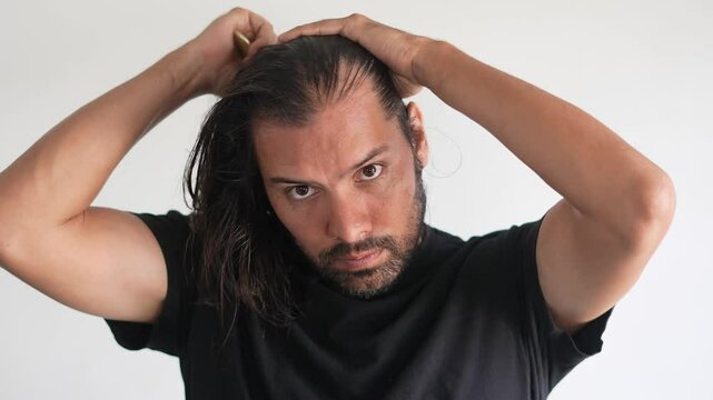 man using brush on his head with baldness, Paddle brush, latino man, hair growth
