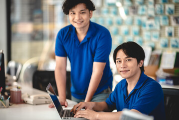 Efficient Business Transactions: Asian Man and Female Salesperson Manage Payment and Bill Transactions Indoors, Ensuring Smooth Financial Transactions in Retail Sales and Customer Purchases