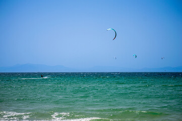 Kitesurfing on Valdevaqueros beach, Gibraltar Strait in Tarifa, Spain