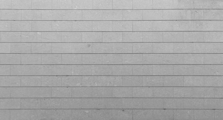 Texture of concrete wall with gray bricks, close-up panoramic image