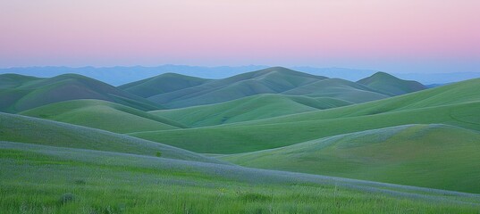 Tranquil countryside sunset with rolling hills, ideal for text placement against the colorful sky