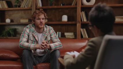 A young man participates in a counseling session, highlighting the importance of mental health support and therapeutic connection