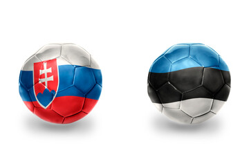 football balls with national flags of estonia and slovakia ,soccer teams. on the white background.