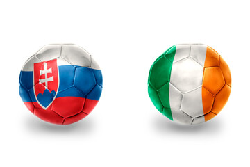 football balls with national flags of ireland and slovakia ,soccer teams. on the white background.