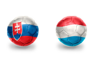 football balls with national flags of luxembourg and slovakia ,soccer teams. on the white...