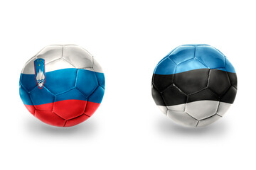 football balls with national flags of estonia and slovenia ,soccer teams. on the white background.