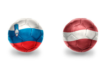football balls with national flags of latvia and slovenia ,soccer teams. on the white background.