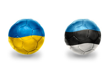 Obraz premium football balls with national flags of estonia and ukraine,soccer teams. on the white background.