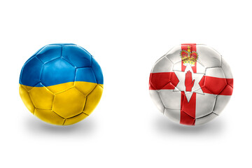 Obraz premium football balls with national flags of northern ireland and ukraine,soccer teams. on the white background.