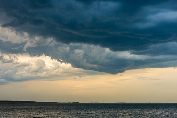the sky before the rain starts, thunderclouds over the lake